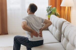 Patient in pain from degenerative disk disease before spine surgery in Houston