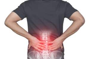 Close up of a man's back that shows back pain needing spinal surgery in Houston, TX